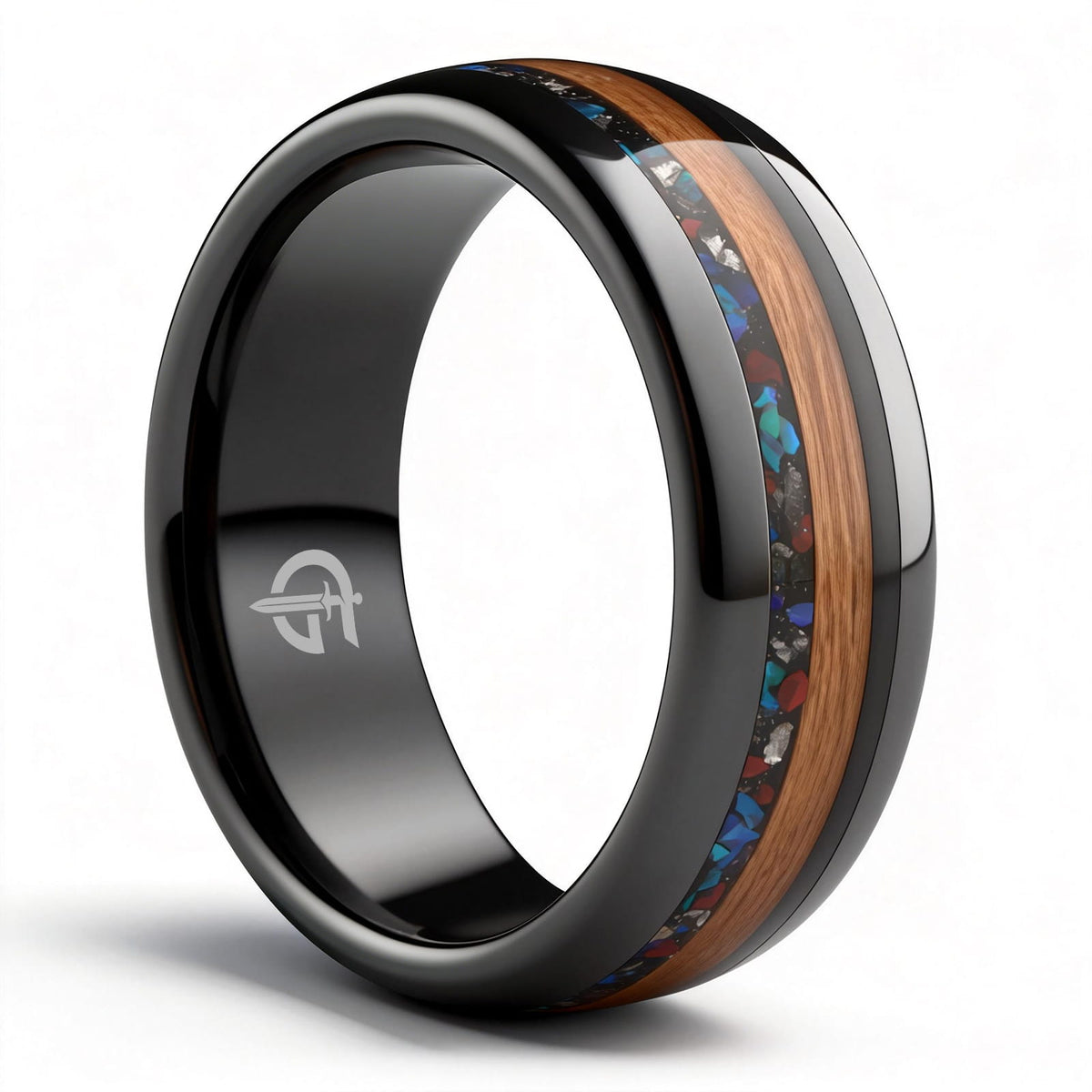 Polished black ceramic ring with brown wood beside blue-green, red and silver-gray inlay fragments.