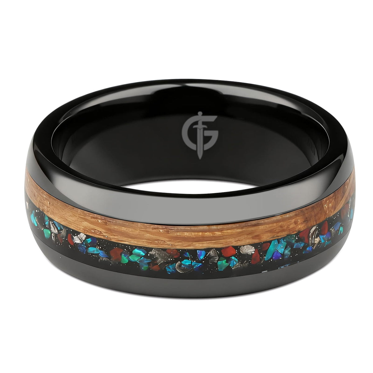 Polished black ceramic ring with brown wood beside blue-green, red and silver-gray inlay fragments.