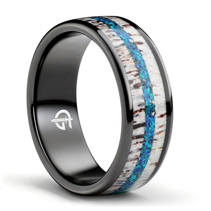 Black ceramic ring with pale deer antler framing blue natural opal and silver-gray meteorite fragments