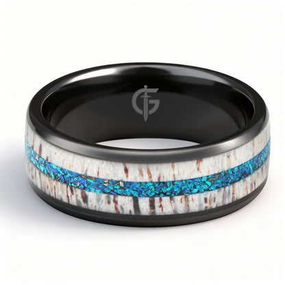 Black ceramic ring with pale deer antler framing blue natural opal and silver-gray meteorite fragments