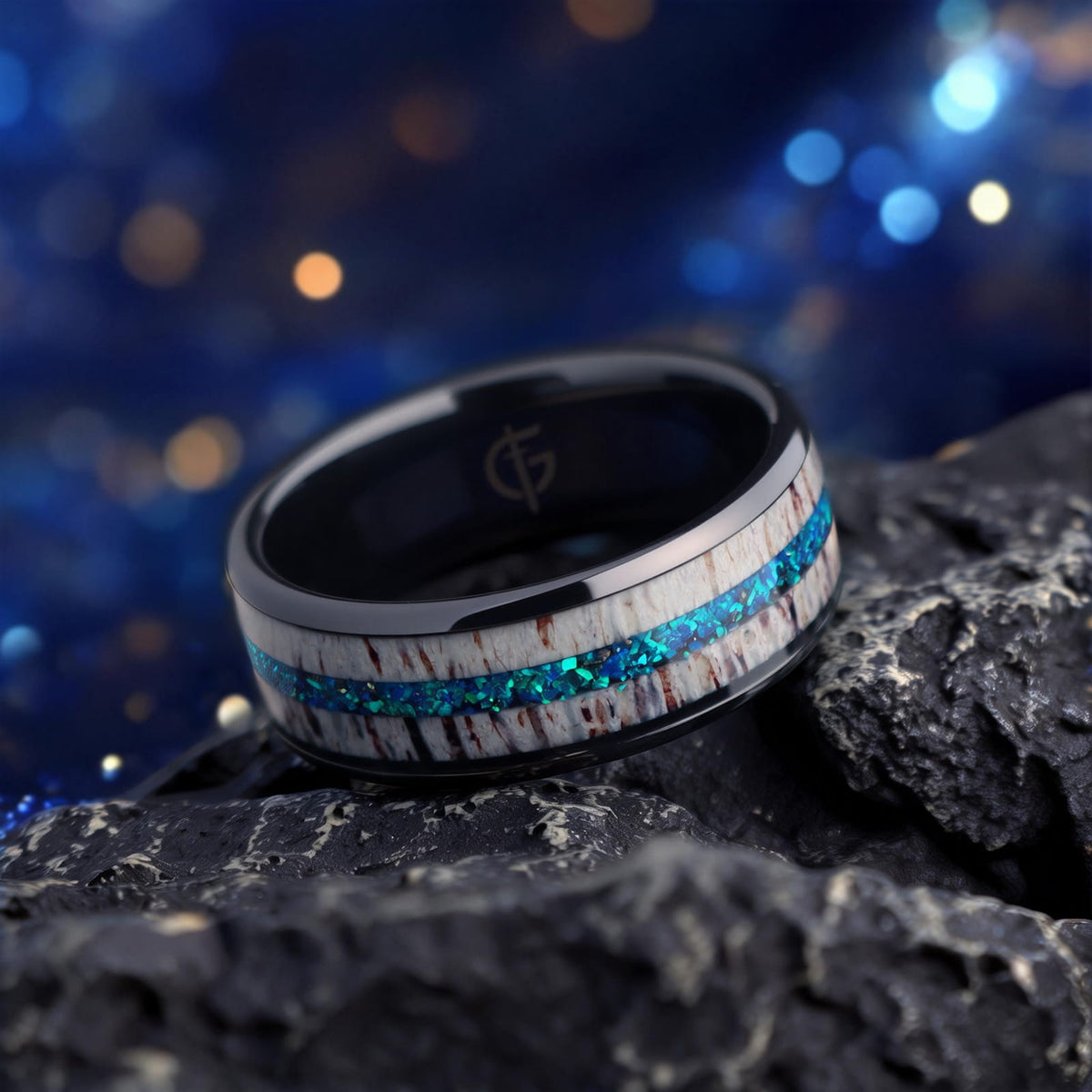 Black ceramic ring with pale deer antler framing blue natural opal and silver-gray meteorite fragments