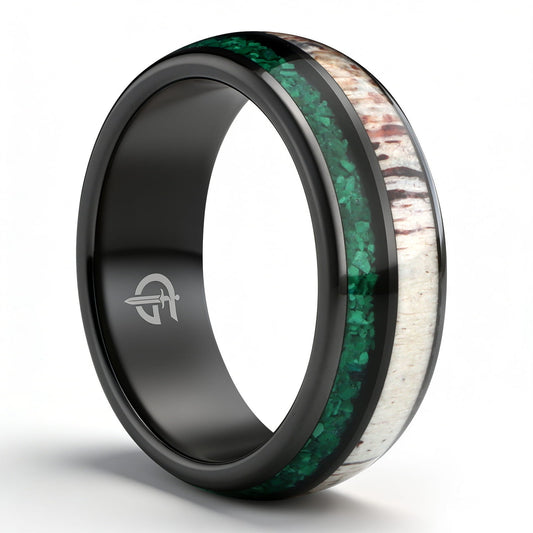Rounded black ceramic ring with separate green malachite and pale, brown-marked deer antler inlays