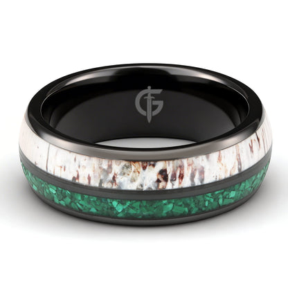 Rounded black ceramic ring with separate green malachite and pale, brown-marked deer antler inlays