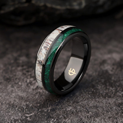 Rounded black ceramic ring with separate green malachite and pale, brown-marked deer antler inlays
