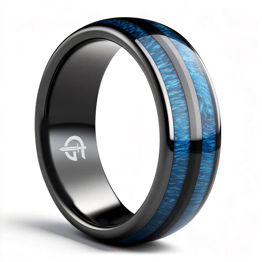 Polished black ceramic ring with two blue whiskey barrel wood inlays separated by a black center strip.