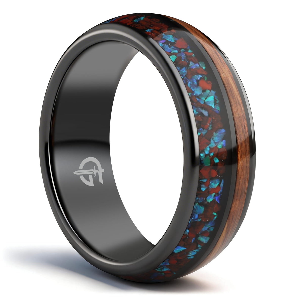 Black ceramic ring with reddish dinosaur bone and blue natural opal beside brown whiskey barrel wood
