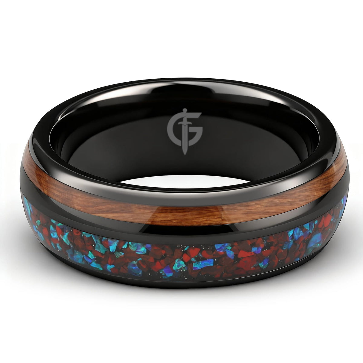 Black ceramic ring with reddish dinosaur bone and blue natural opal beside brown whiskey barrel wood