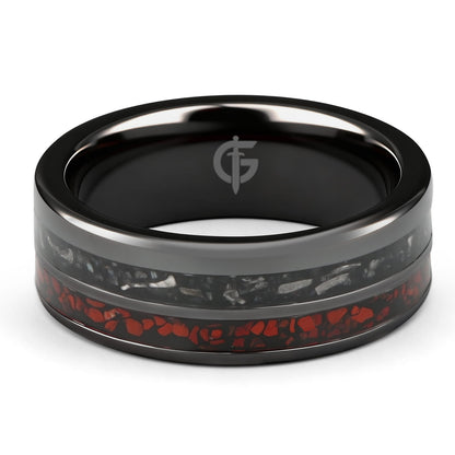 Flat black ceramic ring with red agate and dinosaur bone beside silver-gray meteorite and black agate