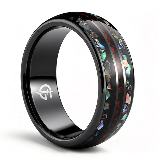 Black ceramic ring with red dinosaur bone center between two iridescent abalone shell and silver-gray meteorite bands.