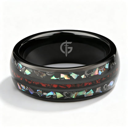 Black ceramic ring with red dinosaur bone center between two iridescent abalone shell and silver-gray meteorite bands.