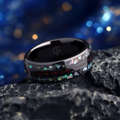 Black ceramic ring with red dinosaur bone center between two iridescent abalone shell and silver-gray meteorite bands.
