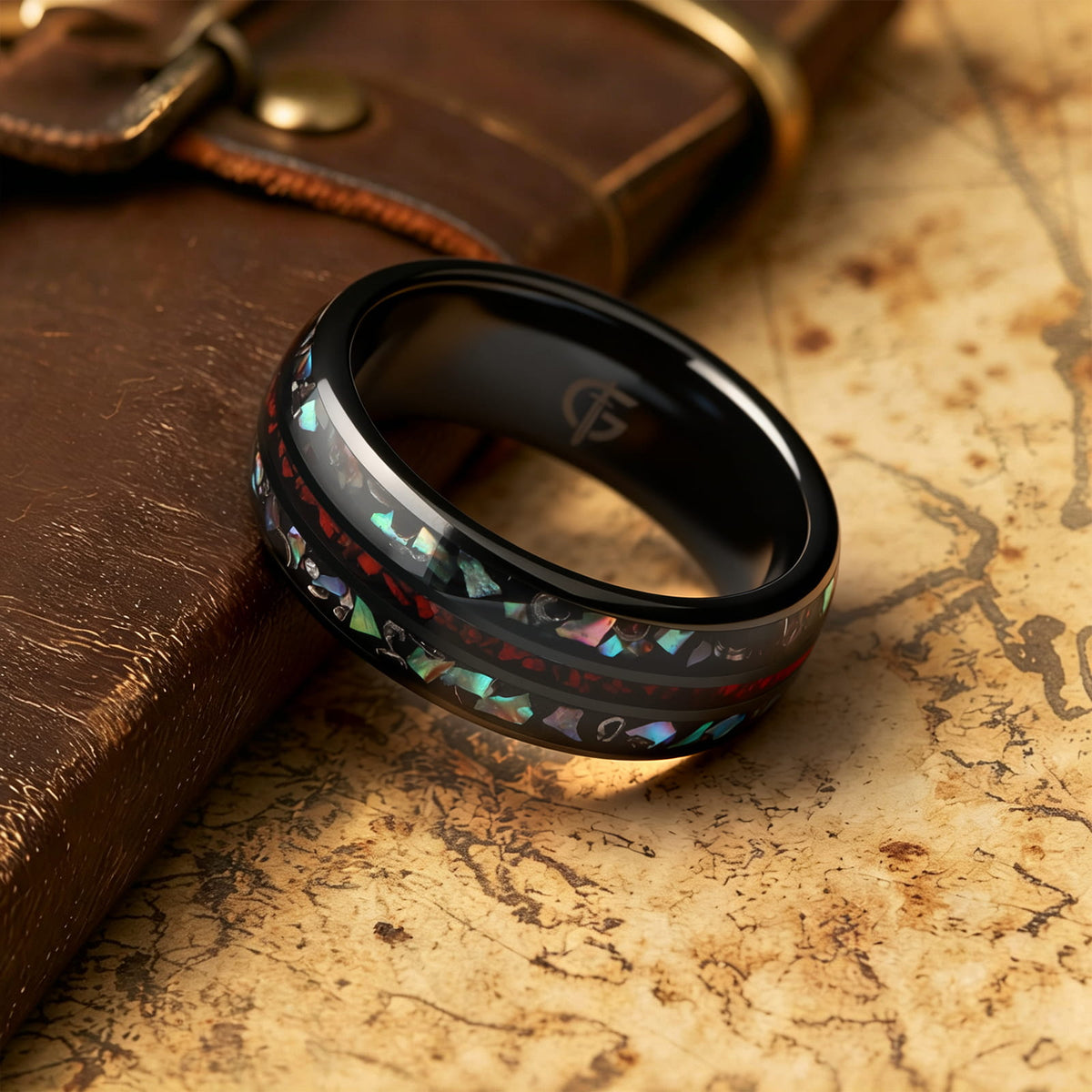 Black ceramic ring with red dinosaur bone center between two iridescent abalone shell and silver-gray meteorite bands.