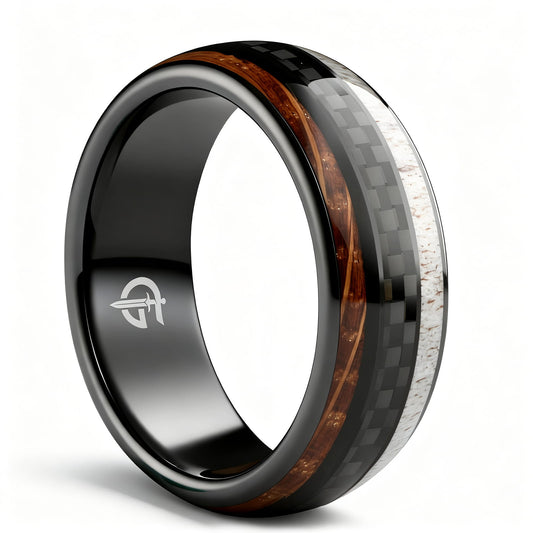 Black ceramic ring with a carbon fiber center between brown wood grain and pale deer antler