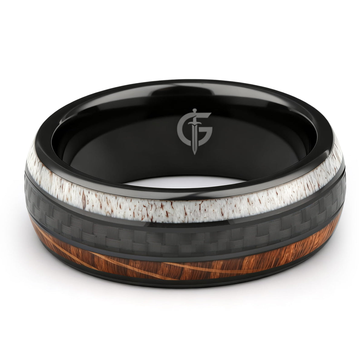Black ceramic ring with a carbon fiber center between brown wood grain and pale deer antler