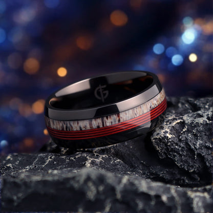 Polished black titanium ring with pale deer antler and parallel red fishing line inlays.