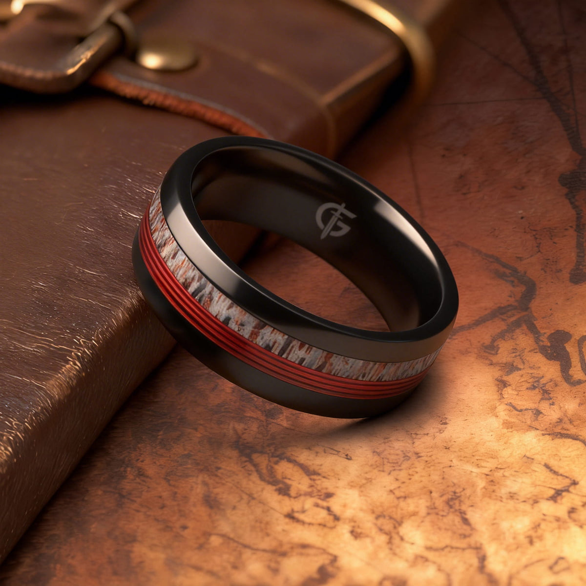 Polished black titanium ring with pale deer antler and parallel red fishing line inlays.
