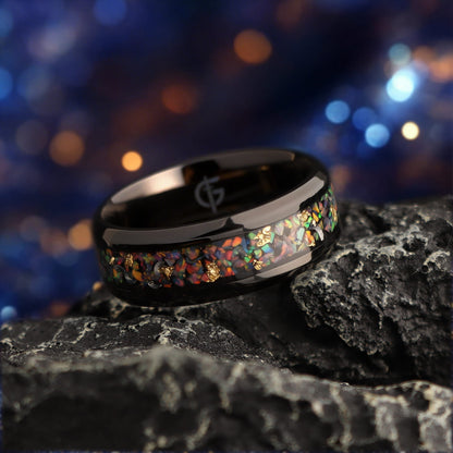 Black titanium ring with multicolored natural opal, silvery meteorite fragments, gold leaf and beveled edges