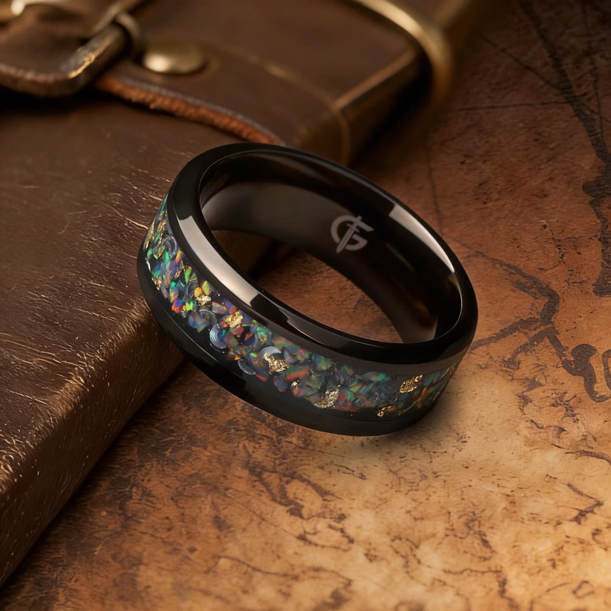 Black titanium ring with multicolored natural opal, silvery meteorite fragments, gold leaf and beveled edges