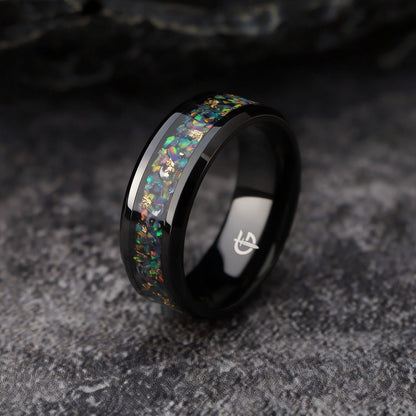 Black titanium ring with multicolored natural opal, silvery meteorite fragments, gold leaf and beveled edges