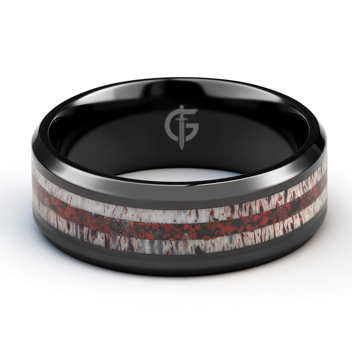 Black titanium ring with pale deer antler bands flanking a reddish mixed inlay and beveled edges