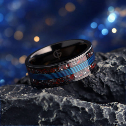 Black titanium ring with blue fishing line centered between mixed red and silver-gray inlay fragments