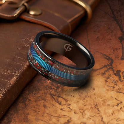 Black titanium ring with blue fishing line centered between mixed red and silver-gray inlay fragments