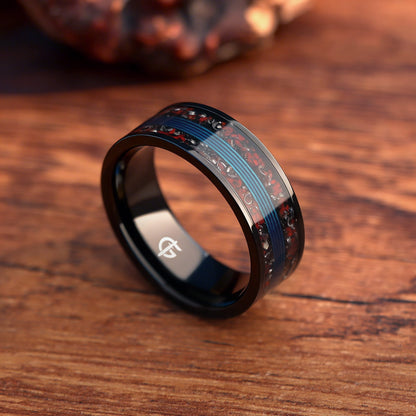 Black titanium ring with blue fishing line centered between mixed red and silver-gray inlay fragments