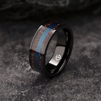Black titanium ring with blue fishing line centered between mixed red and silver-gray inlay fragments