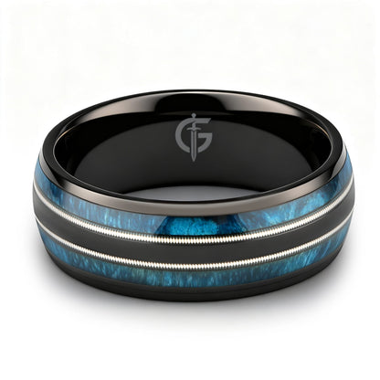 Black titanium ring with blue whiskey barrel wood and silver-tone guitar strings in two mirrored channels