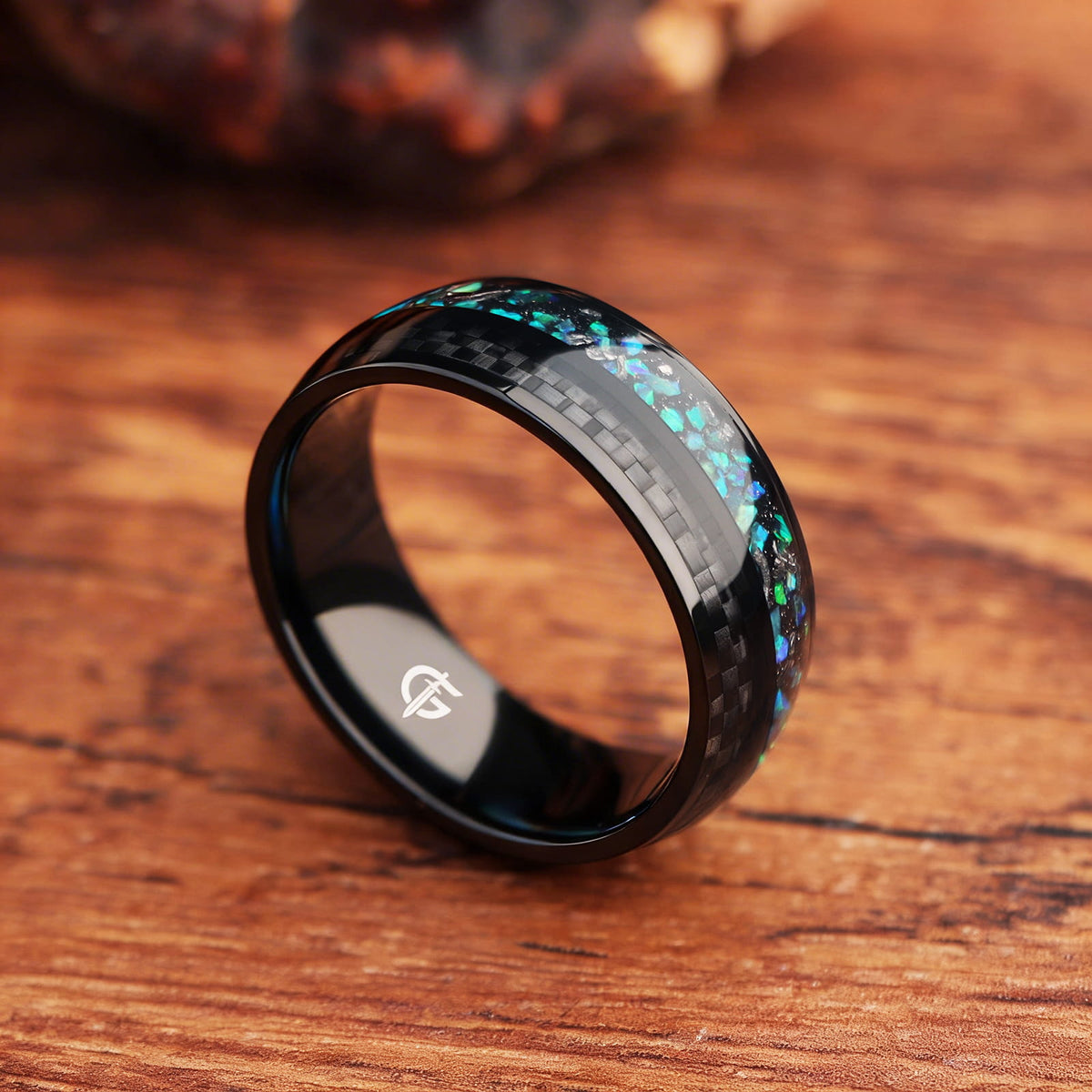 Black titanium ring with green and teal natural opal, Gibeon meteorite fragments and a separate carbon-fiber inlay