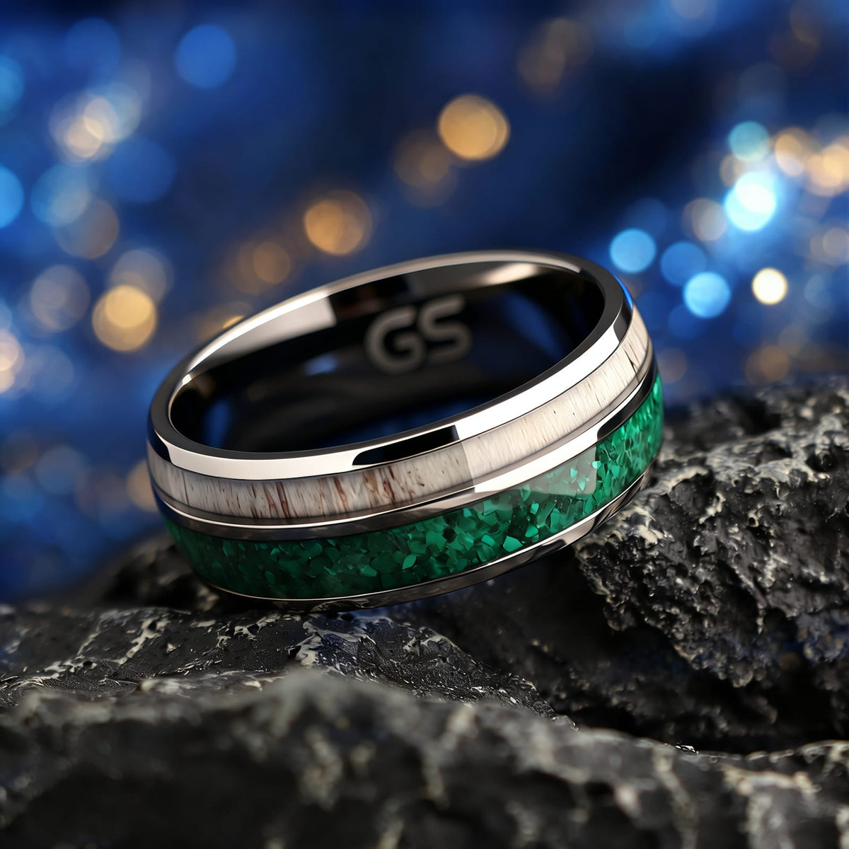 Titanium ring with black interior, green malachite and pale deer antler in separate inlay channels