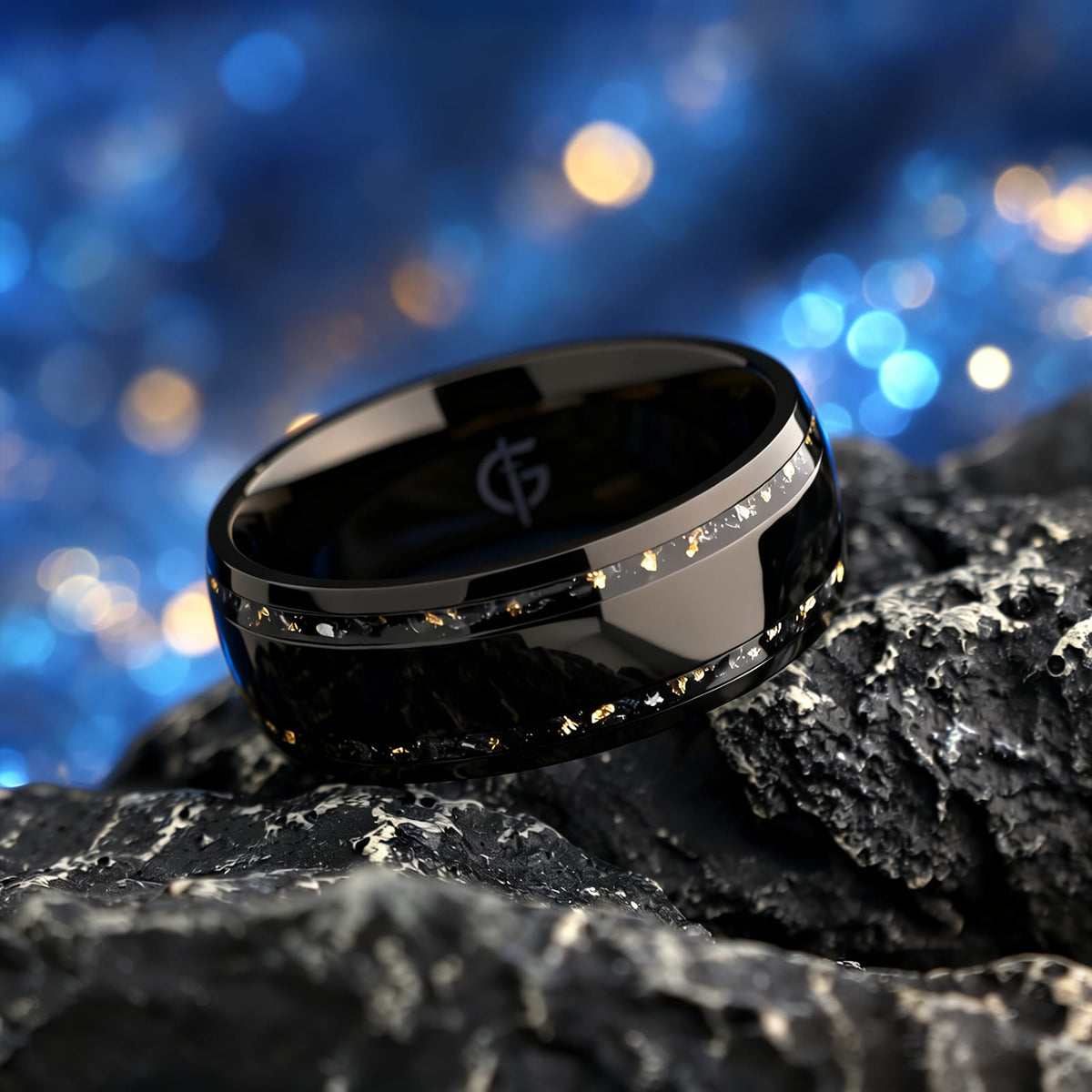 Black titanium ring with a broad polished center and two narrow meteorite and gold leaf inlays