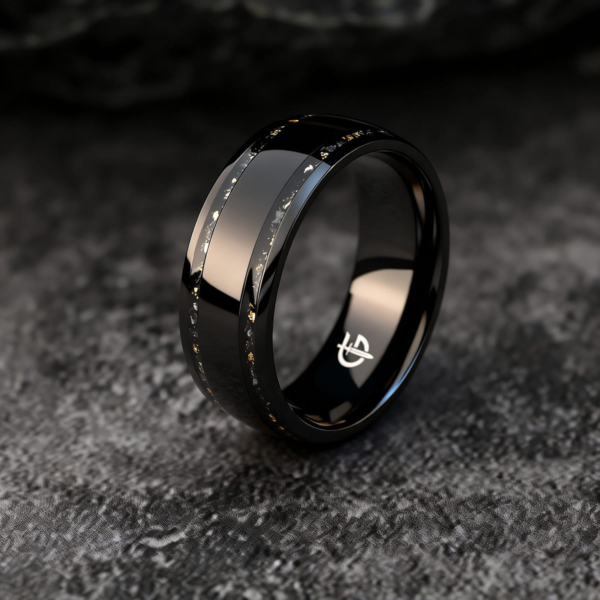 Black titanium ring with a broad polished center and two narrow meteorite and gold leaf inlays