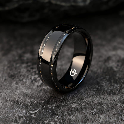 Black titanium ring with a broad polished center and two narrow meteorite and gold leaf inlays