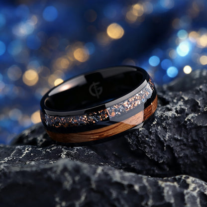 Black titanium ring with whiskey barrel wood beside a silver-gray meteorite, moonstone and copper inlay.
