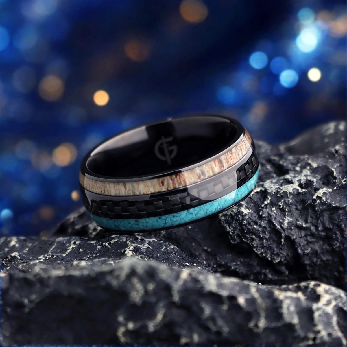 Black titanium ring with pale deer antler and blue turquoise flanking a black carbon fiber center