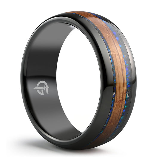 Black tungsten ring with central brown whiskey barrel wood flanked by blue natural opal and meteorite fragments.