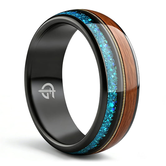 Black tungsten ring with brown whiskey barrel wood, gold-colored guitar string and blue opal inlays