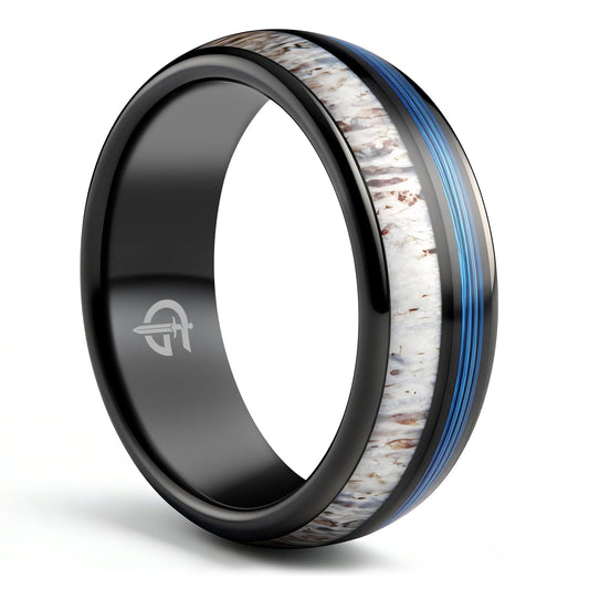Domed black tungsten ring with blue fishing line and brown-patterned pale deer antler in separate grooves