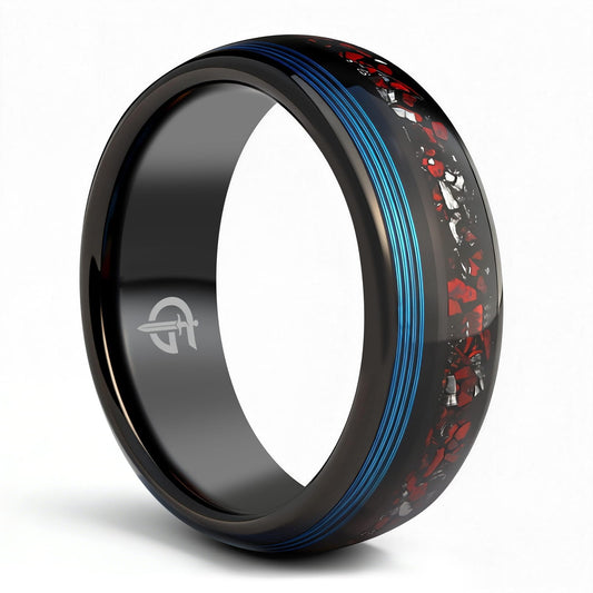 Polished black tungsten ring with fine blue fishing line beside red dinosaur bone and silver-gray meteorite fragments