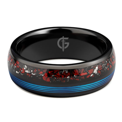 Polished black tungsten ring with fine blue fishing line beside red dinosaur bone and silver-gray meteorite fragments