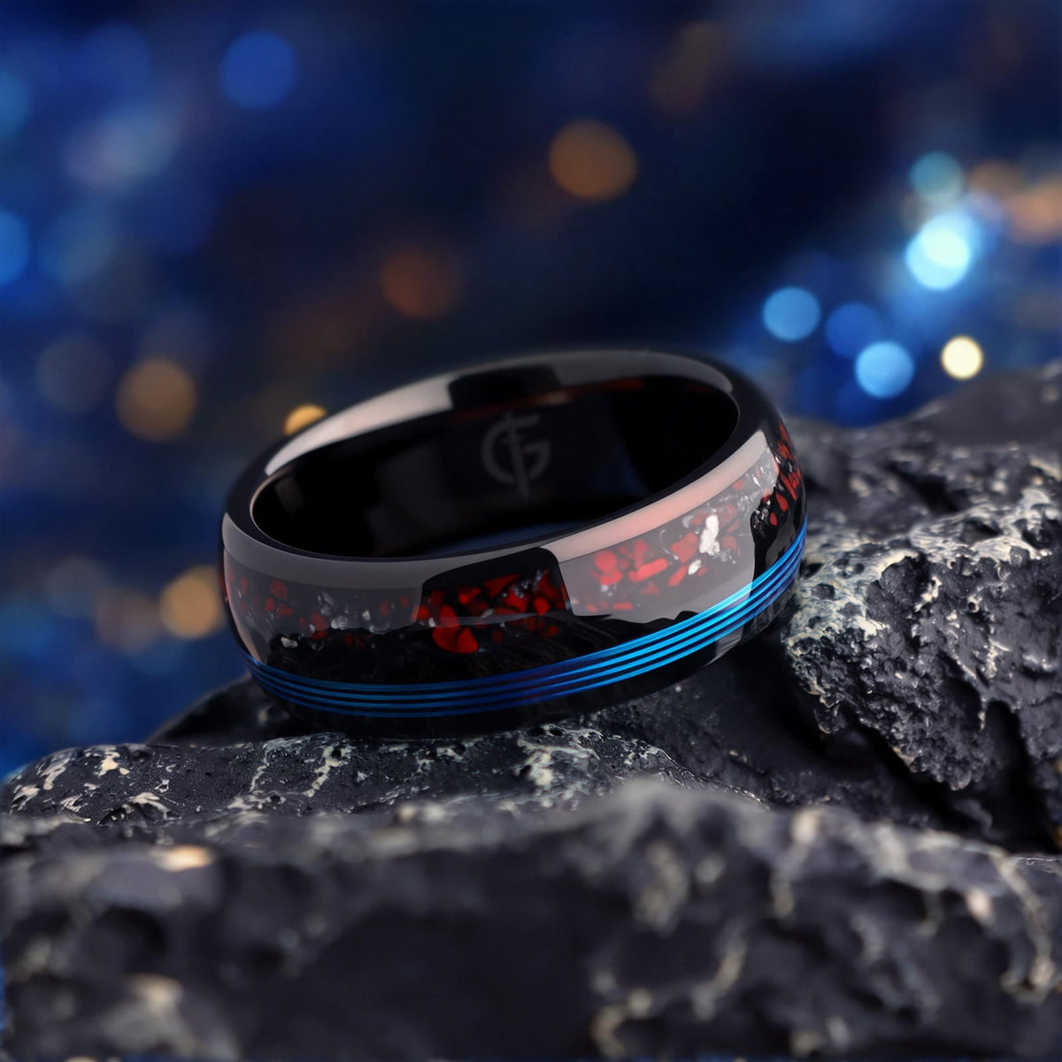 Polished black tungsten ring with fine blue fishing line beside red dinosaur bone and silver-gray meteorite fragments