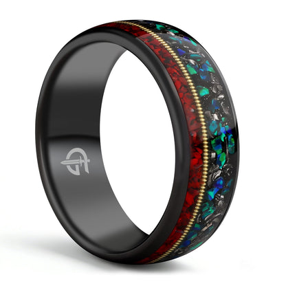 Polished black tungsten ring with gold-colored guitar string between red dinosaur bone and mixed meteorite and blue-green opal