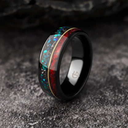 Polished black tungsten ring with gold-colored guitar string between red dinosaur bone and mixed meteorite and blue-green opal