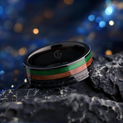 Polished black tungsten carbide ring with green fishing line, brown whiskey barrel wood and silver-gray meteorite
