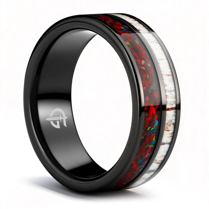 Polished black tungsten ring with pale deer antler beside red dinosaur bone and multicolored natural opal