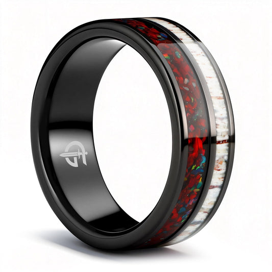Polished black tungsten ring with pale deer antler beside red dinosaur bone and multicolored natural opal