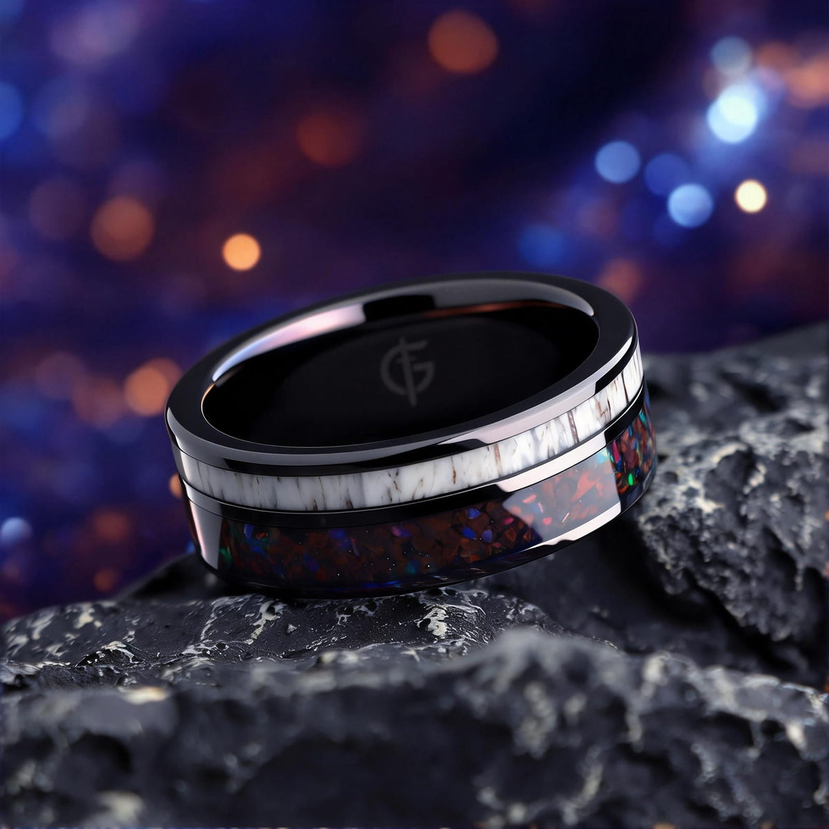 Polished black tungsten ring with pale deer antler beside red dinosaur bone and multicolored natural opal