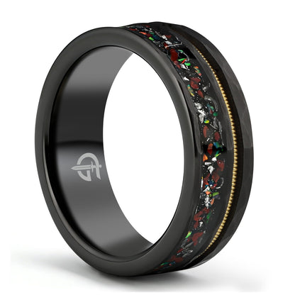 Hammered black tungsten carbide ring with a gold-tone guitar string and red-brown, silver-gray and multicolor inlays