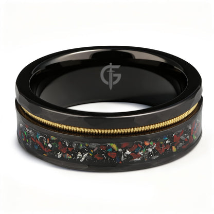Hammered black tungsten carbide ring with a gold-tone guitar string and red-brown, silver-gray and multicolor inlays